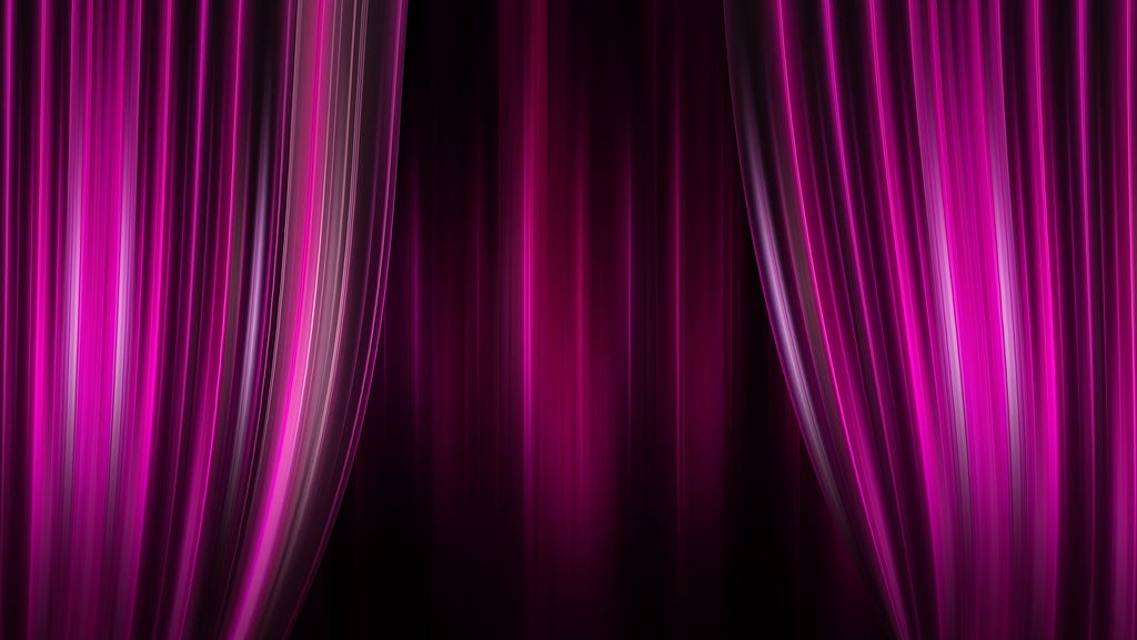 A pink theater curtain, partially open.