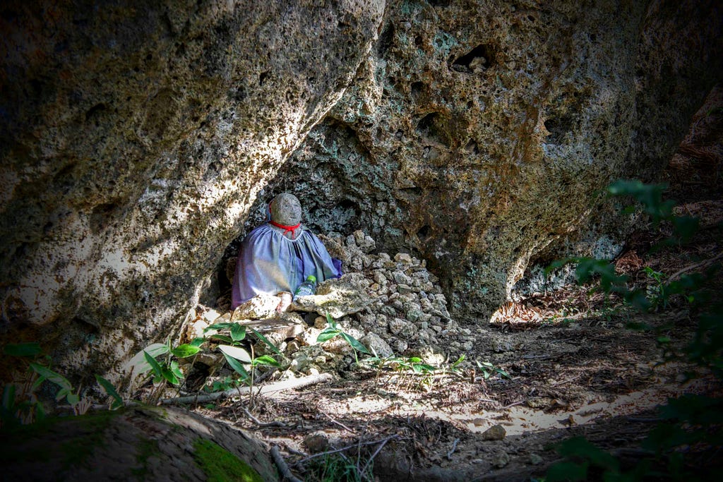 A Jizo statue tucked neatly under the rocks near the Kyozuka (mound of sutras) and the summit of Mt. Kyogakura