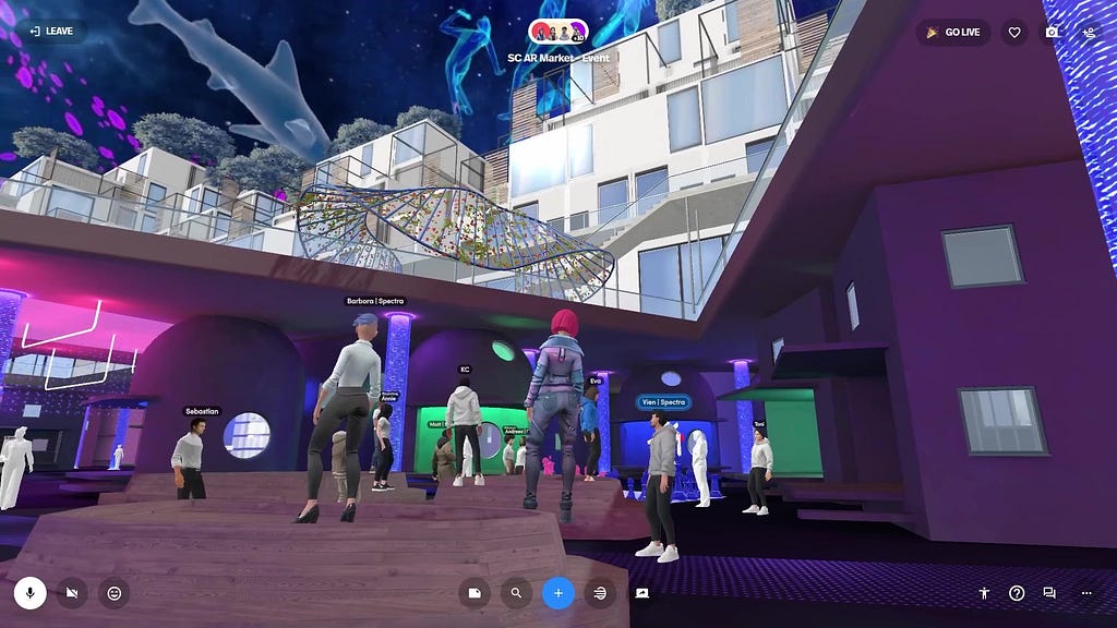A group of human avatars in a virtual reality scene standing on the ground floor marketplace of a city block courtyard, looking up at a night sky full of augmented reality sharks and other aquatic animals.