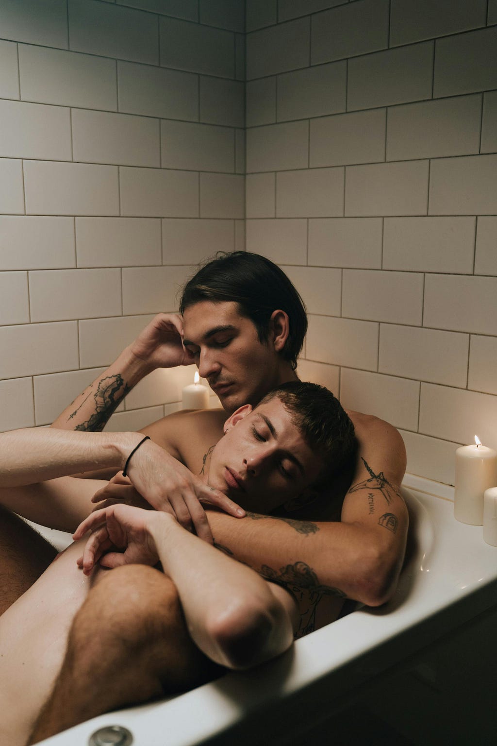 Two naked men in a bath