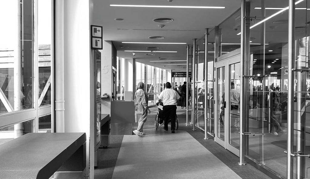 Ezeiza airport with people with protection besides people without anything.
