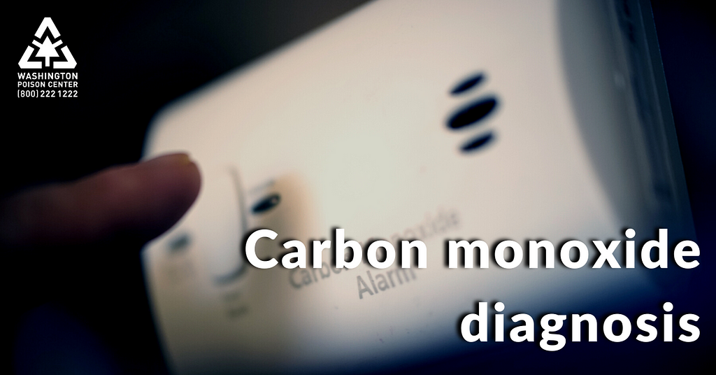 Finger about to push the test button on a carbon monoxide alarm