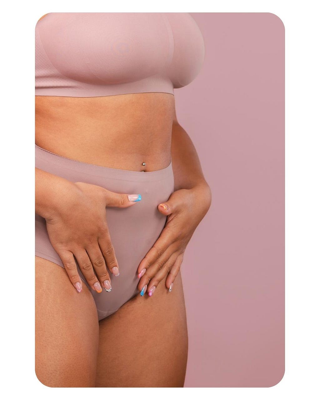 Picture of a woman holding her stomach.