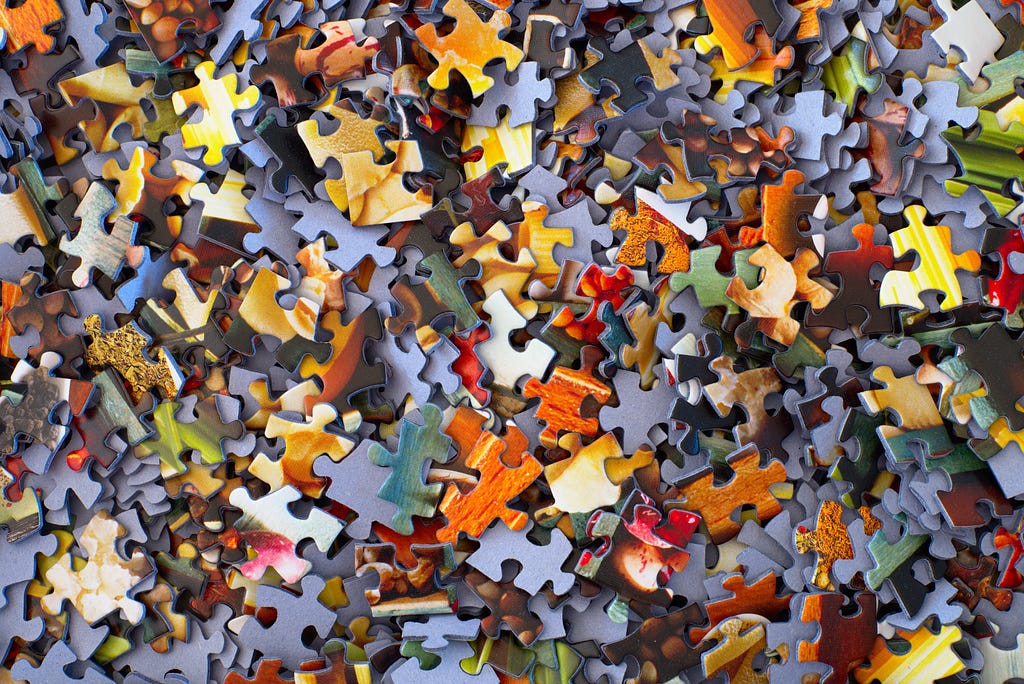 A scattering of puzzle pieces, reflecting the complexity of ME/CFS