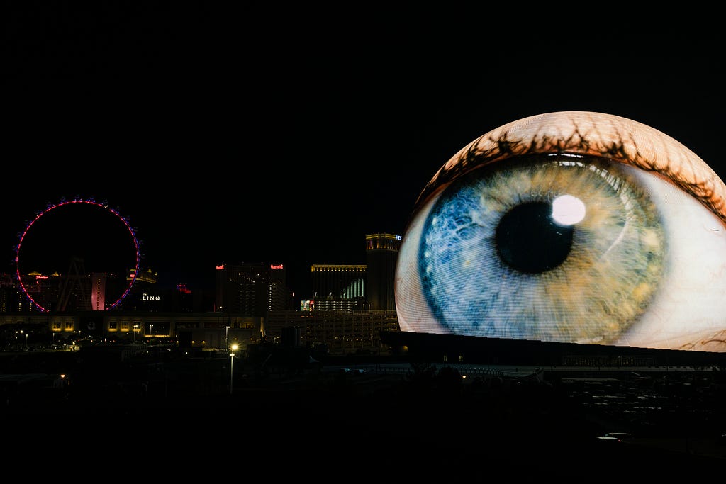 A shot showing The Sphere in the Las Vegas skyline, with the external LED screens depicting an eyeball