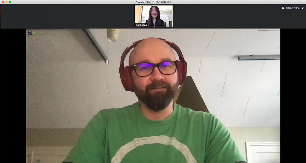 Picture of April on a video chat with another designer for the portfolio review interview