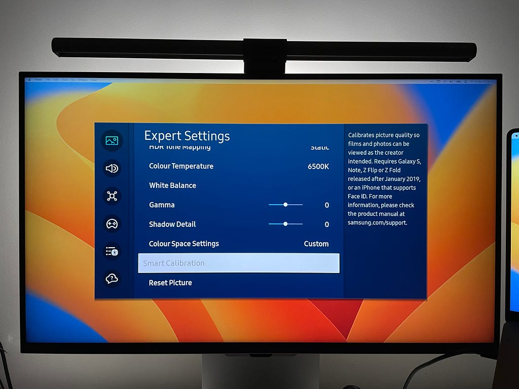 Samsung monitor’s on-screen display with the ‘Smart Calibration’ option disabled while displaying the MacBook’s video output.