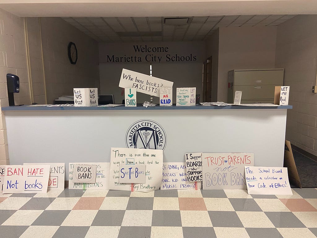 Signs against book bans