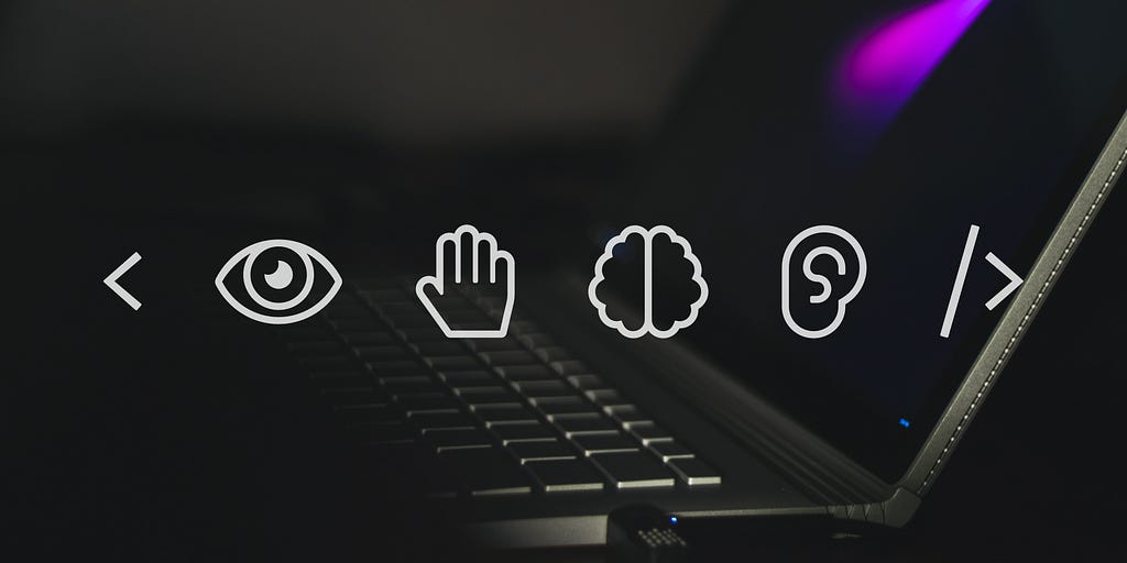 Photo of a laptop. Four icons: an eye, a hand, a brain and an ear.