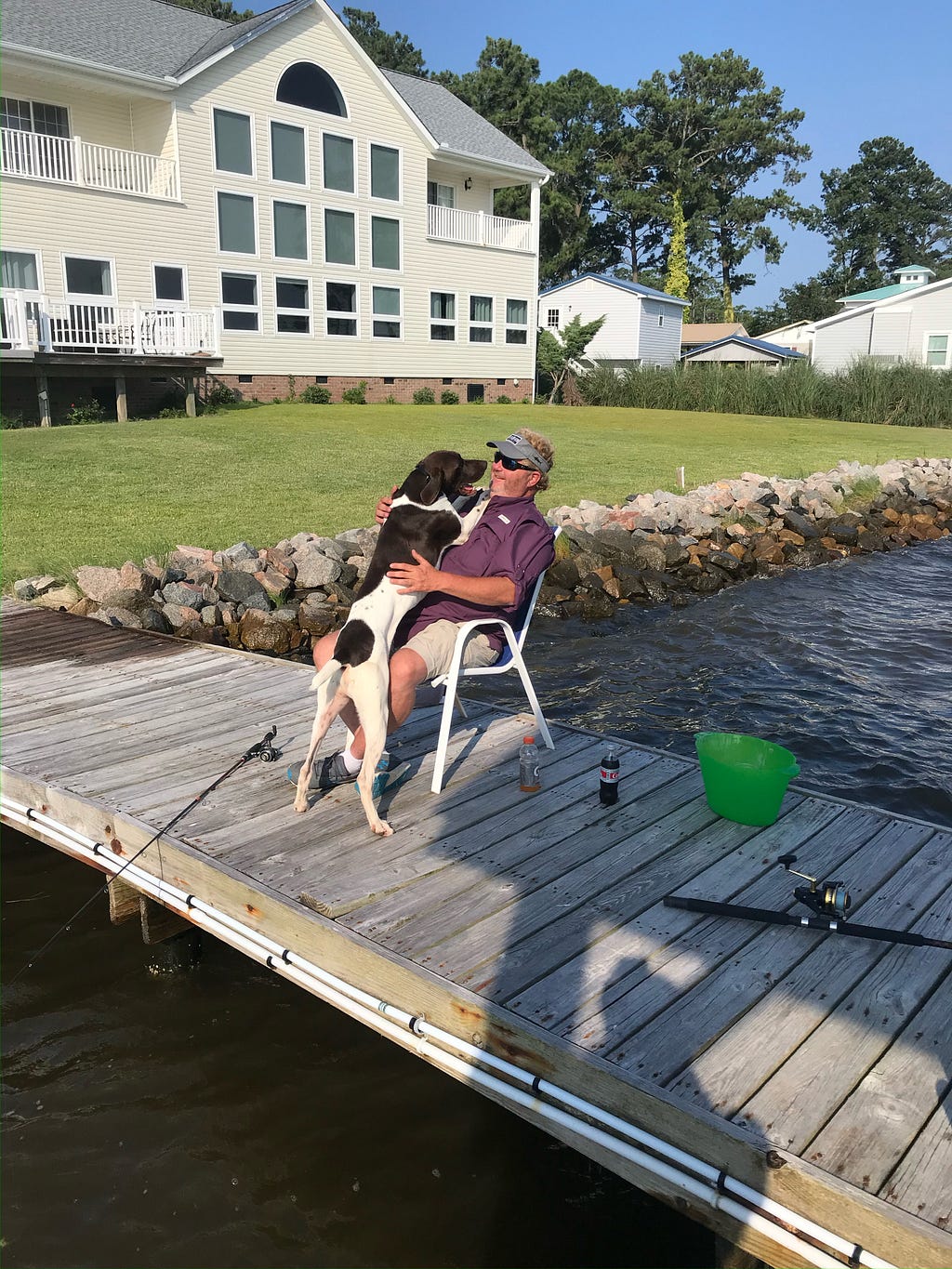 David Harris with his dog at his home near Morehead City, NC