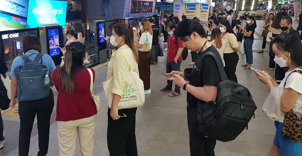 People lining up for the Bangkok Skytrain