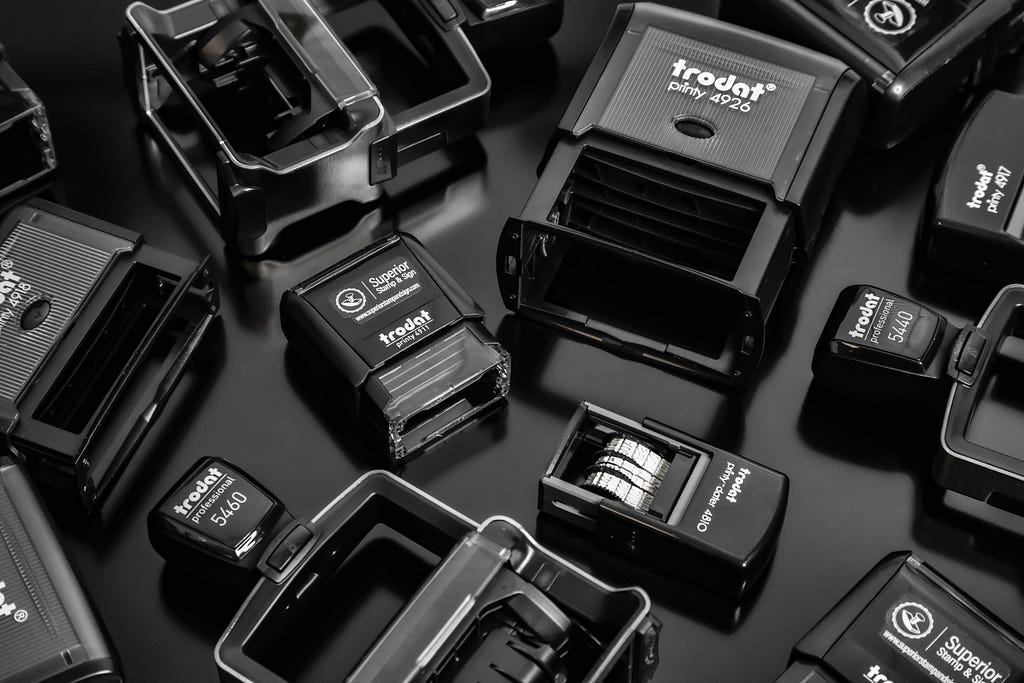 a lot of professional grade camera flashes laid out on a surface