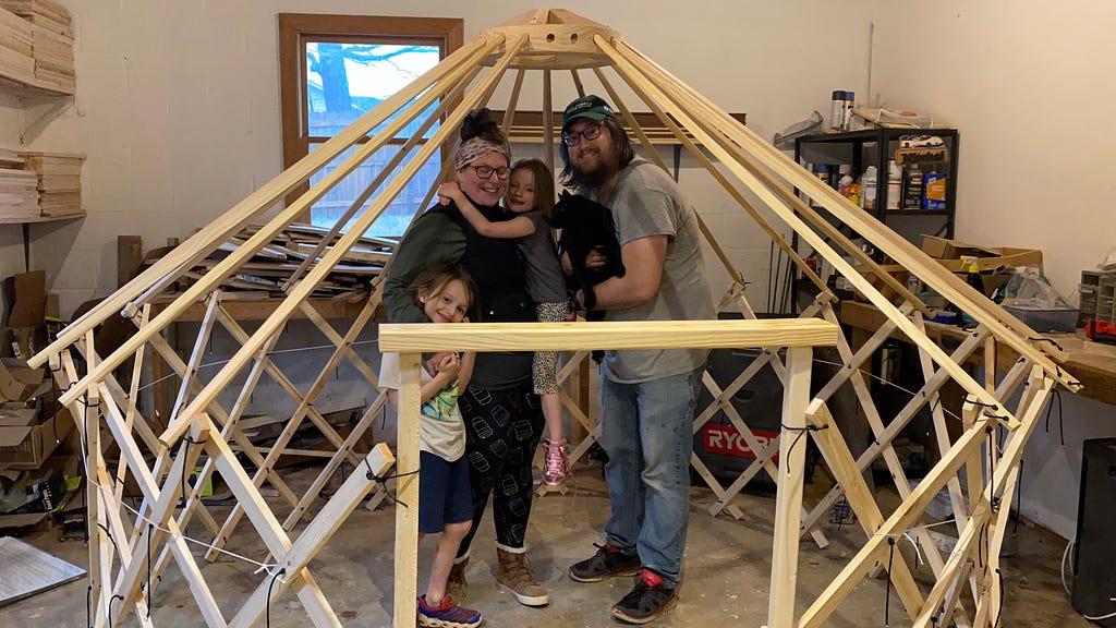 Lee, Kaitlan, Josie and Mitch with the yurt frame we built.