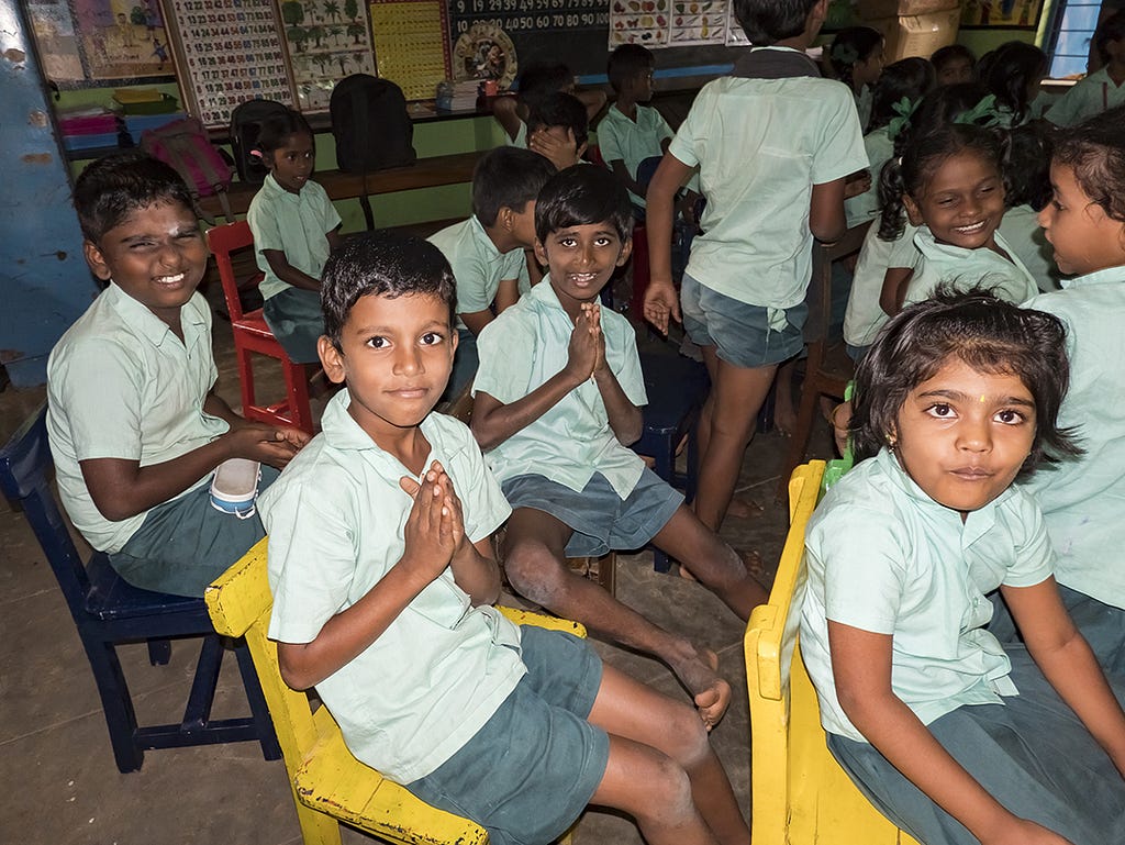Pudicherry, India | School children holding Prana mudra hand gestures. (Photo 150237614 © Catherinelprod Catherine | Dreamstime.com)