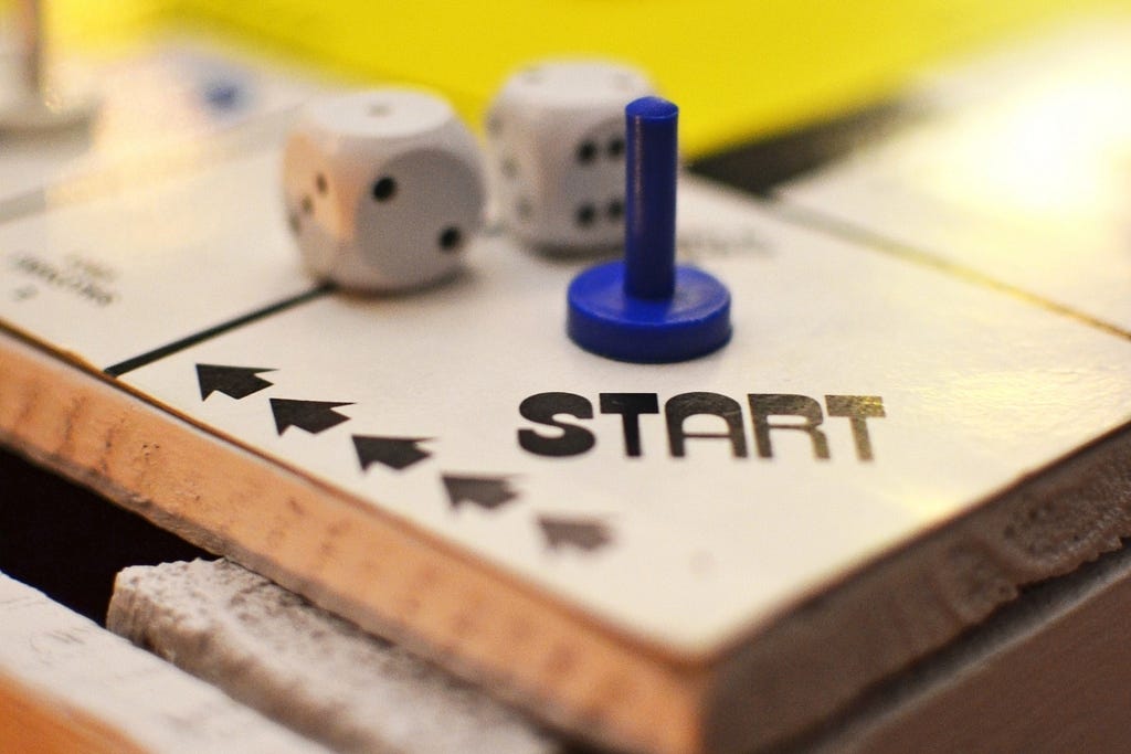 Game piece at the starting square of a board game