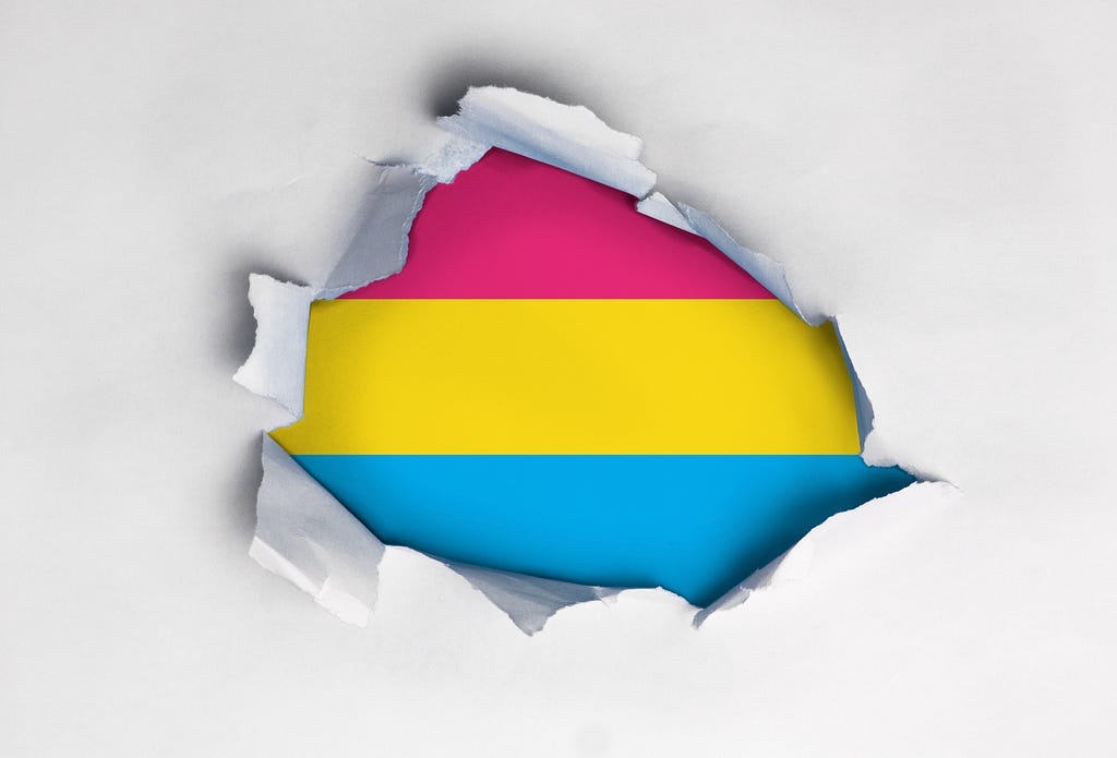<a href=’https://www.freepik.com/photos/gay-flag'>Gay flag photo created by Vectorium — www.freepik.com</a> Ripped Paper with Pansexual flag in the middle