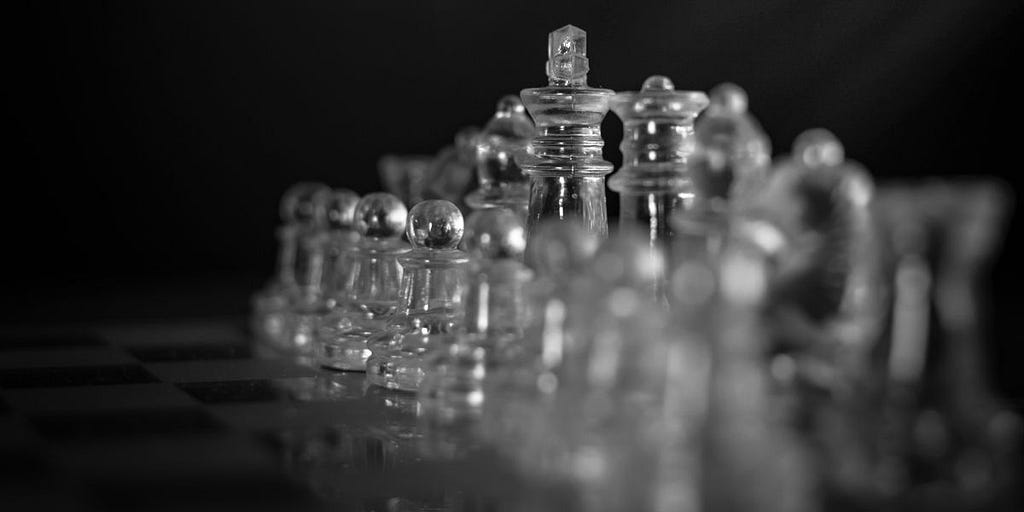 Chess pieces in an orderly row