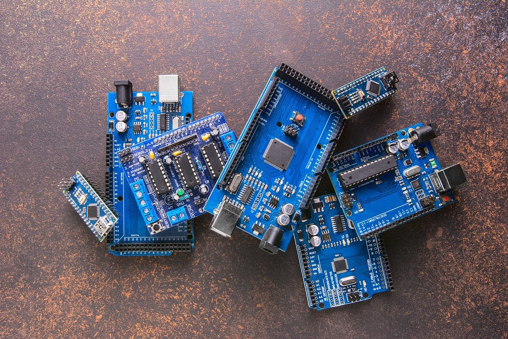 A pile of Arduino boards ready to be turned into small but capable devices.