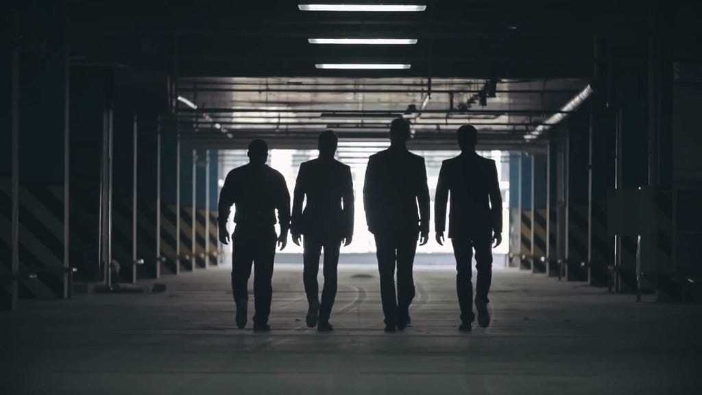 Silhouettes of four men