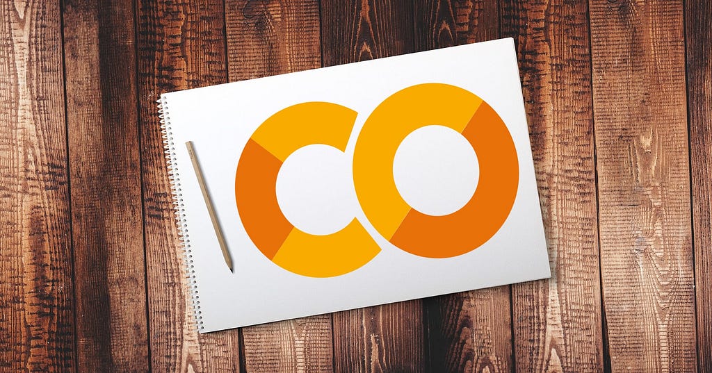 Google Colaboratory logo on photo of notepad