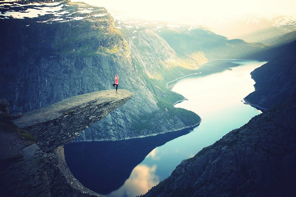 Woman on a high rock.