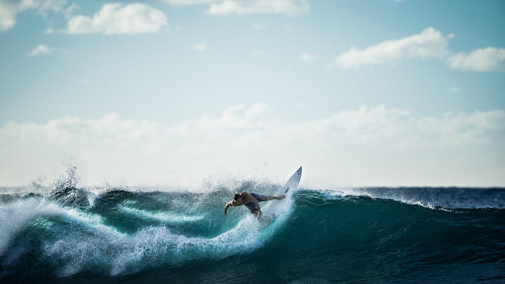 A man surfing a wave.
