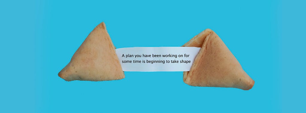 A fortune cookie saying “A plan you have been working on is beginning to take shape” Img credit: Elena Koycheva — Unsplash
