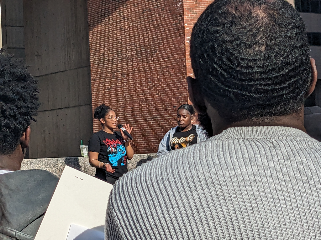 Photo of a student speaking at the recent student City Hall rally for better facilities and a better BPS