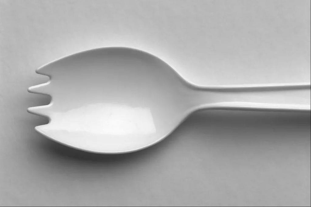 A spork, a combination of a spoon and a fork.