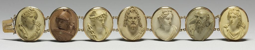 Cameos in raised relief of the Olympic gods. The seven gods depicted are the gods of the planets