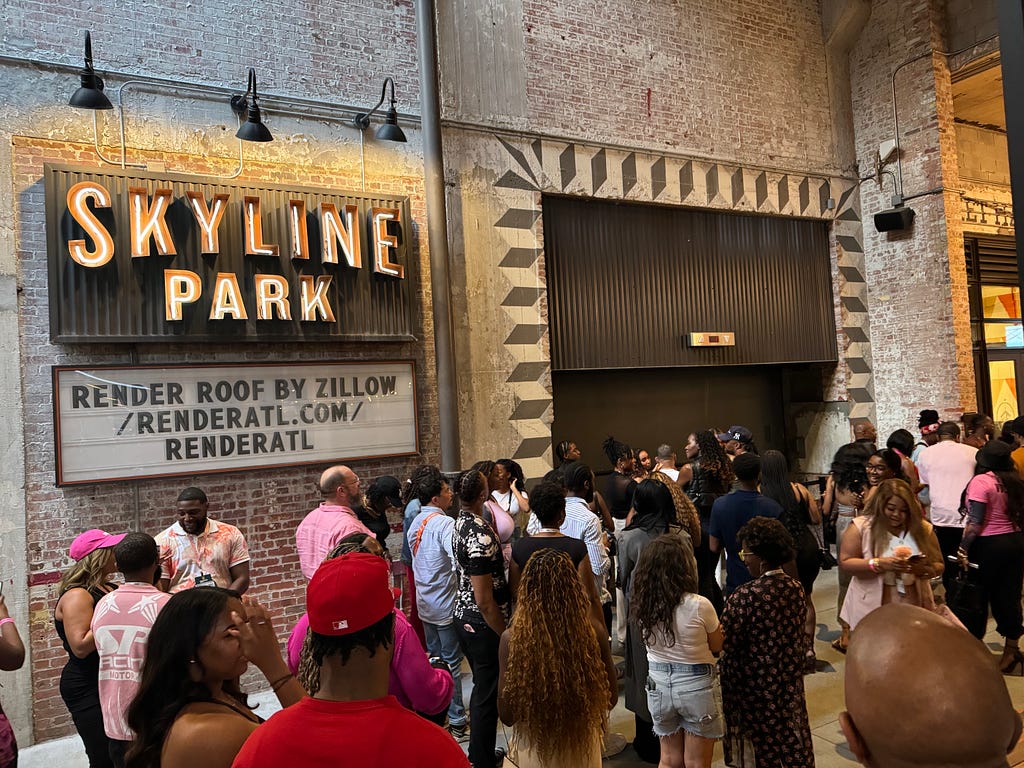 Attendees wait in line to attend an after-hours event at the Ponce Market rooftop.