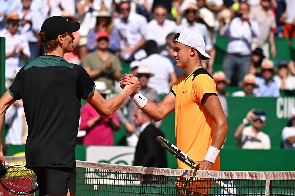 Holger Rune shares an amicable handshake with Jannik Sinner after losing in three sets in ATP Masters 1000 Monte-Carlo. | Image Credit: Holger Rune/X via Getty Images