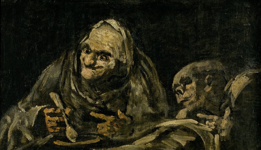 Old man with a horrible smile eating food