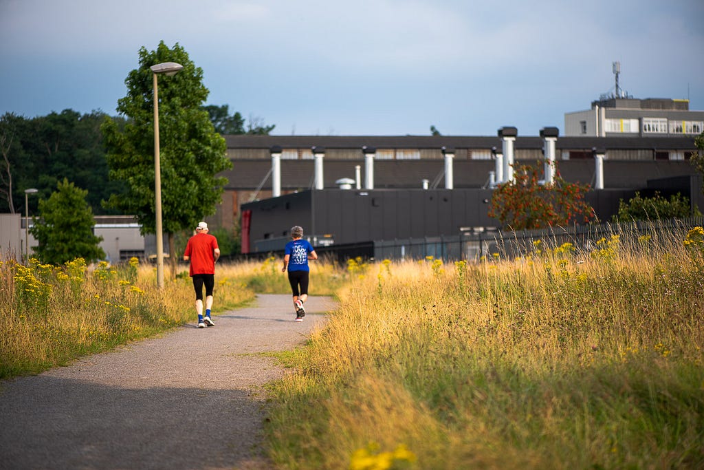 I wasn’t quite ready for the senior running couple, my mind still busy thinking about the nearby blast furnace. But I include one of the series of quick frames because thinking about a future that allows me to stay that active and share it with someone represents happiness to me. Hattingen, Germany, 17 July 2024.