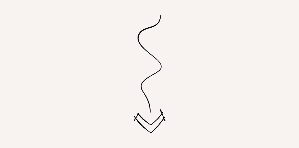 A pen-drawn illustrative arrow pointing down