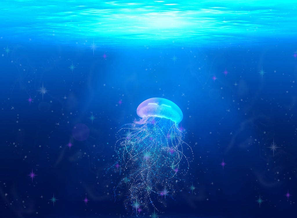 jellyfish with tentacles in the ocean, floating under the glowing surface