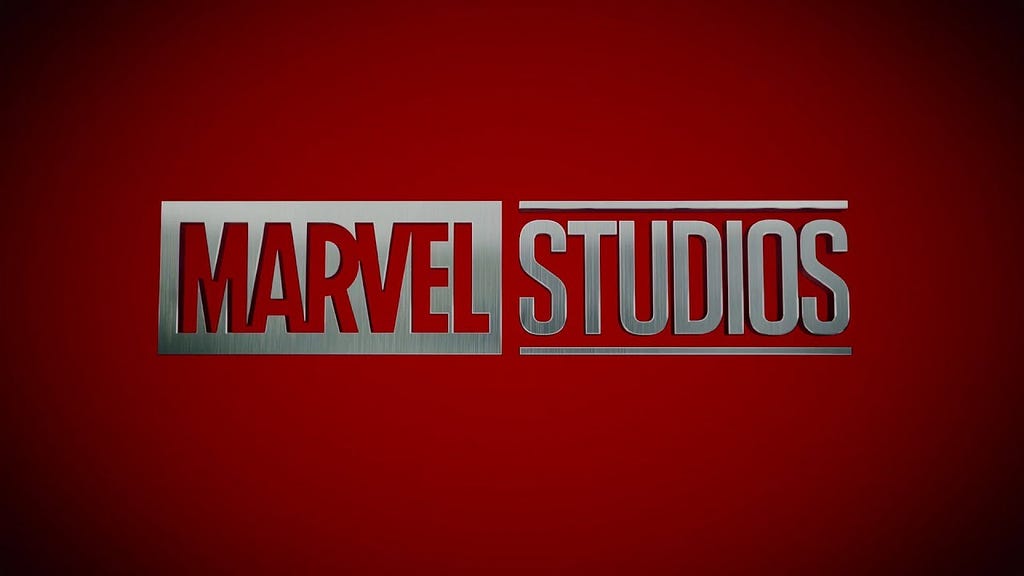 Marvel Studios’ silver logo, with a red background and faded black corners.