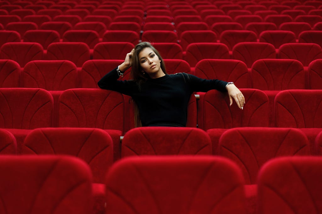 Actor sitting in empty theater