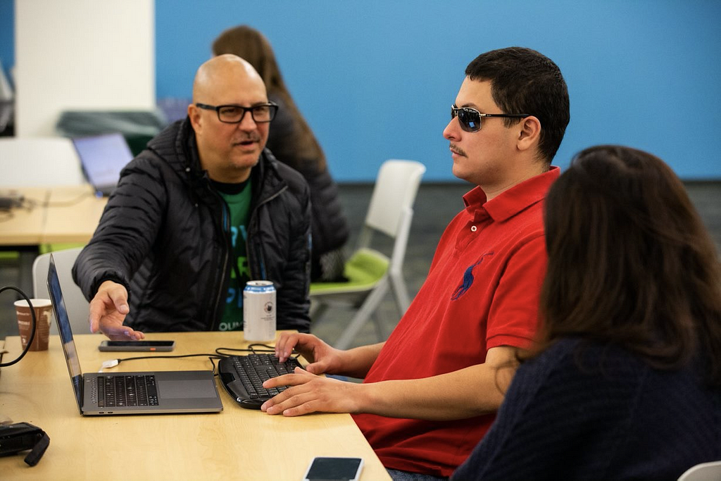 VMware accessibility engineer Chris Lane (Left) with Nicholas Alvarez and Nhi Nguyen (middle and right) @ A11y hackathon
