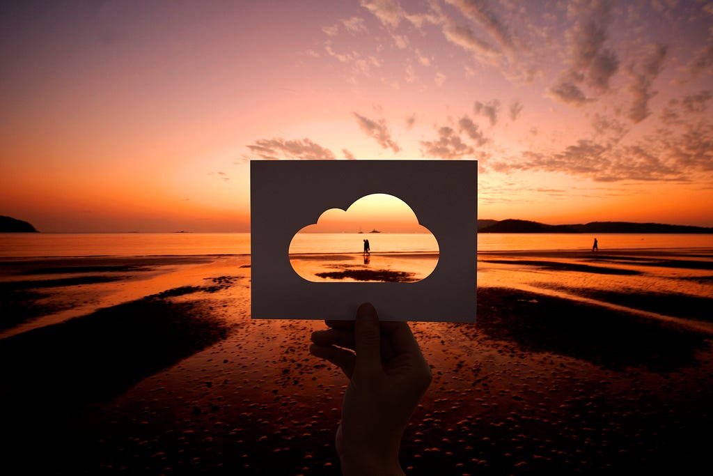 Dating couple standing on the beach on the sunset