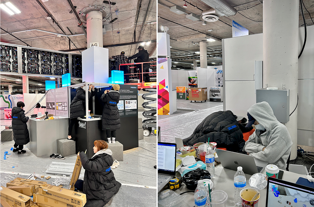 People assemble parts of the booth and gray hoodie guy sleeping sitting on the chair