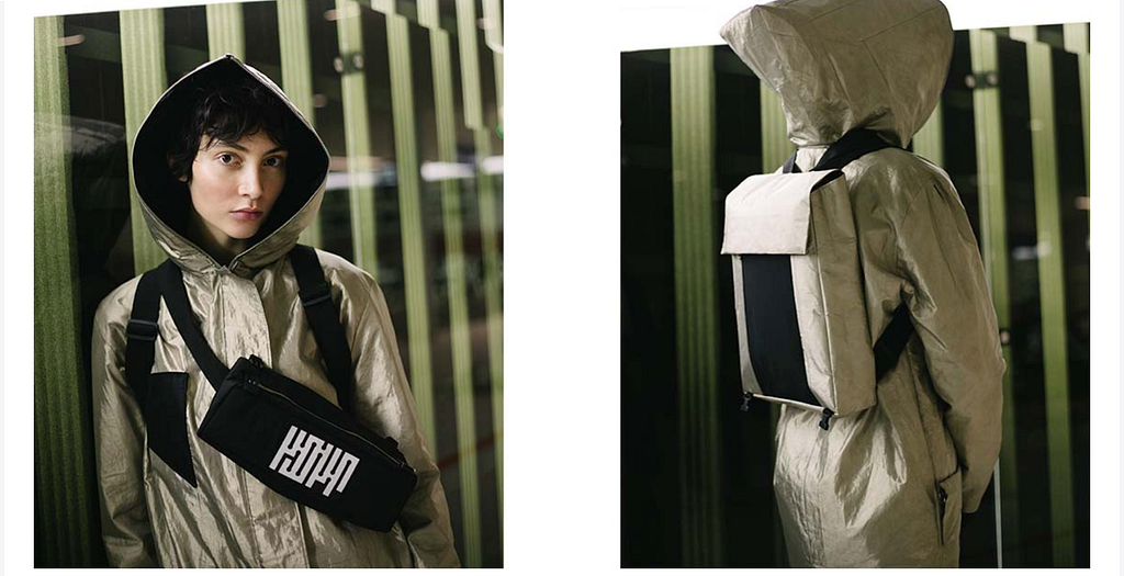 A model sports an anti-surveillance coat and carrying backpack created by the company Project Kovr.