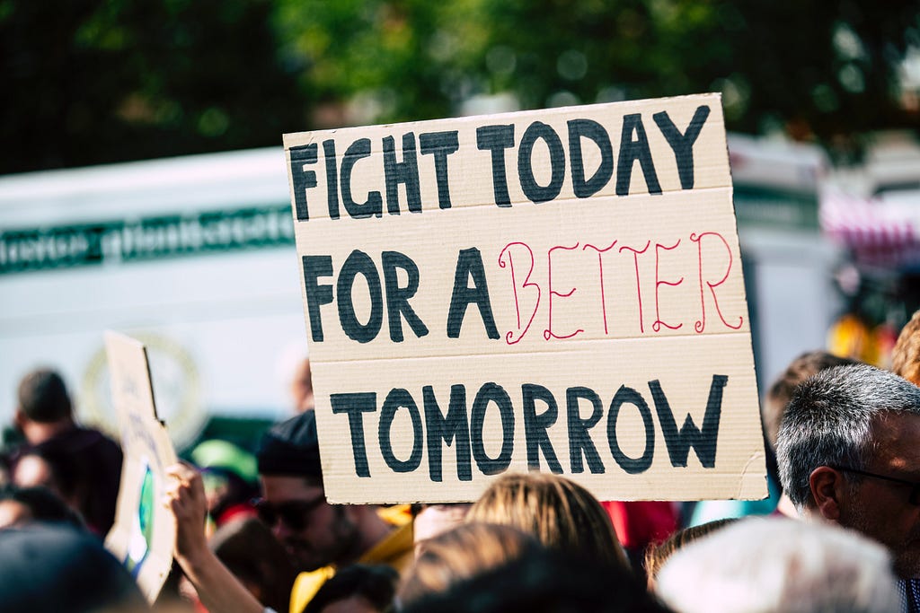 A demonstration sign that says: Fight today for a better tomorrow.