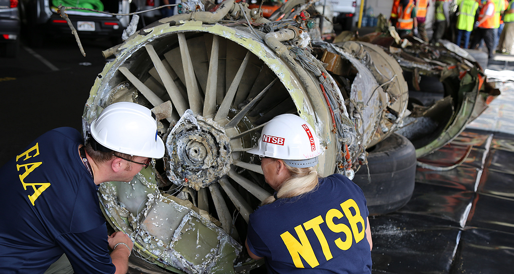Photo of FAA and NTSB inspectors.