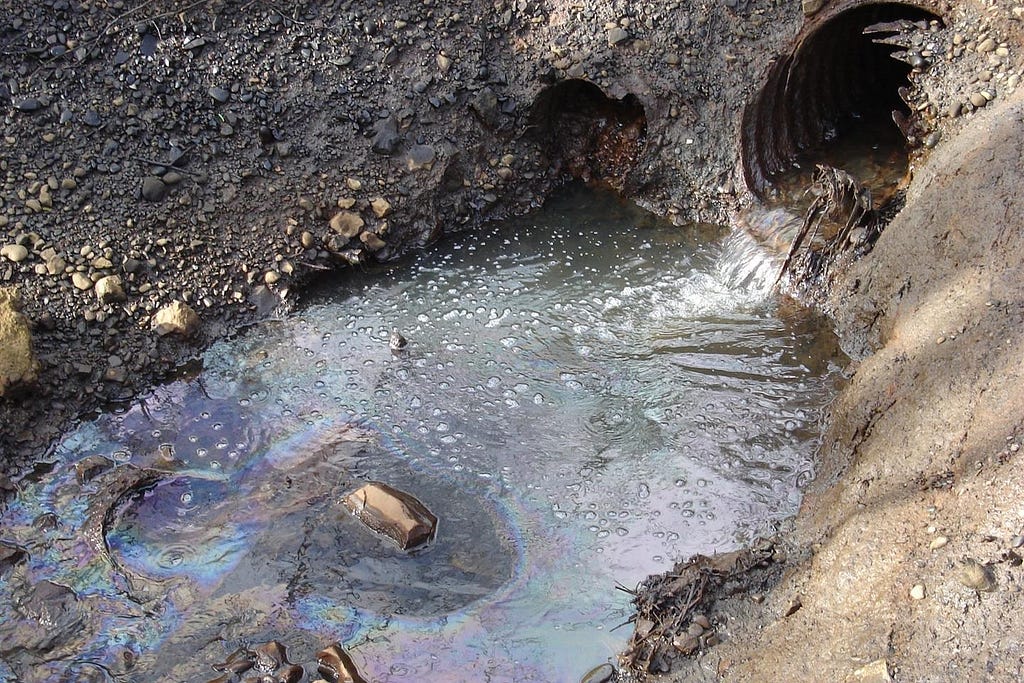 Photo of polluted stormwater runoff flowing from a pipe.