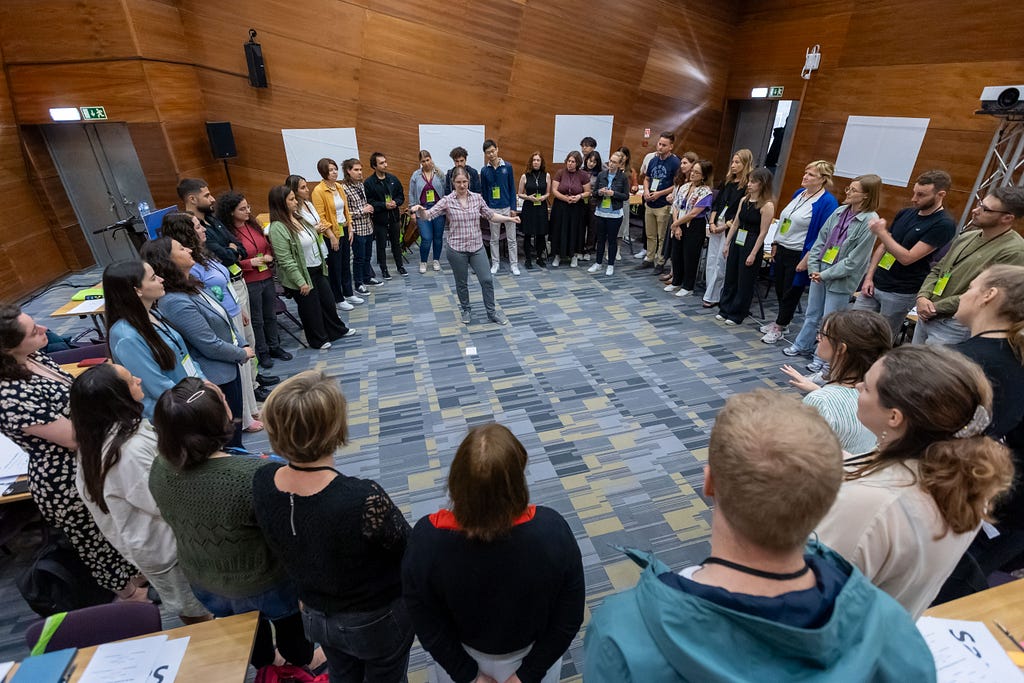 Workshop attendees standing in a circle during Hannah’s workshop.