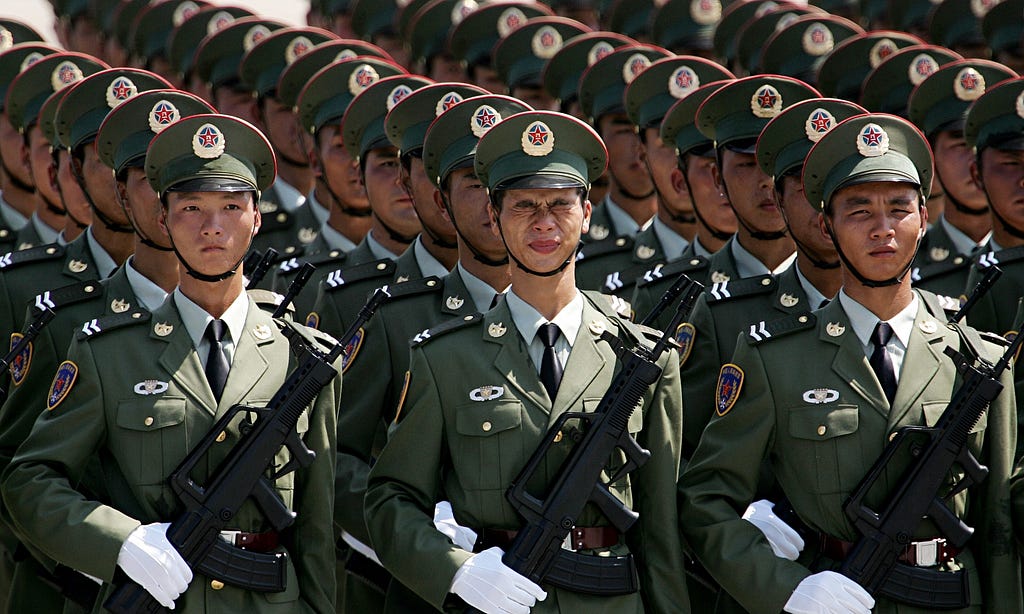 Ranks of Chinese troops on dress parade.