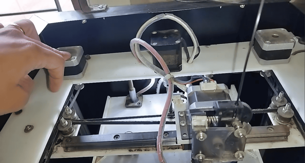 X-axis motor — Provides left/right movement for the extruder assembly