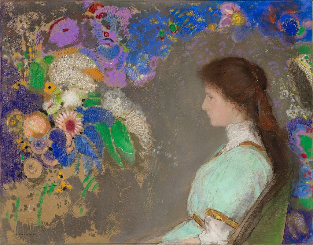 Painting by Redon of young woman seated from waist up in profile. A profusion of flowers around her.