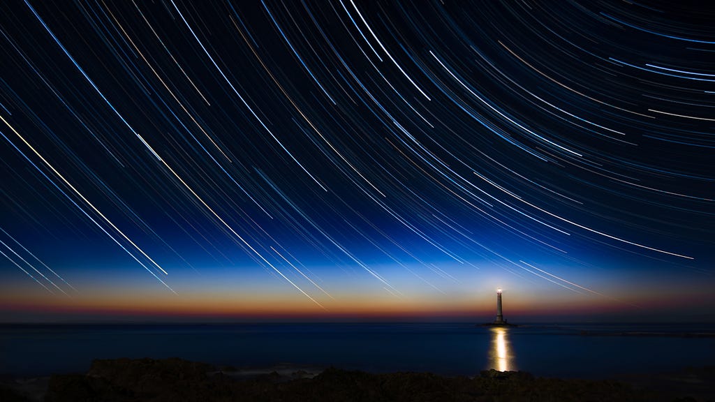 A lighthouse underneath the Milky Way galaxy